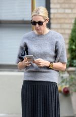 KELLY RUTHERFORD Hails a Cab in New York 10/14/2015