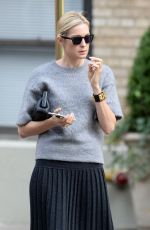 KELLY RUTHERFORD Hails a Cab in New York 10/14/2015
