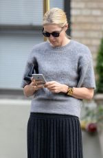 KELLY RUTHERFORD Hails a Cab in New York 10/14/2015