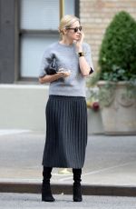 KELLY RUTHERFORD Hails a Cab in New York 10/14/2015