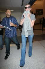 KIRSTEN DUNST in Jeans at LAX Airport 10/17/2015