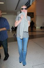 KIRSTEN DUNST in Jeans at LAX Airport 10/17/2015