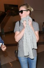 KIRSTEN DUNST in Jeans at LAX Airport 10/17/2015