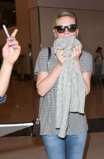 KIRSTEN DUNST in Jeans at LAX Airport 10/17/2015