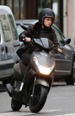 KRISTEN STEWART Riding a Bike on the Set of Personal Shopper in Paris 10/28/2015