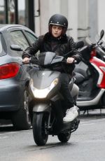 KRISTEN STEWART Riding a Bike on the Set of Personal Shopper in Paris 10/28/2015