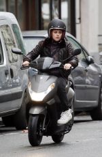 KRISTEN STEWART Riding a Bike on the Set of Personal Shopper in Paris 10/28/2015