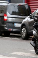 KRISTEN STEWART Riding a Bike on the Set of Personal Shopper in Paris 10/28/2015