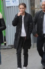 KRISTEN STEWART Riding a Bike on the Set of Personal Shopper in Paris 10/28/2015