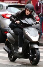 KRISTEN STEWART Riding a Bike on the Set of Personal Shopper in Paris 10/28/2015
