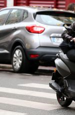KRISTEN STEWART Riding a Bike on the Set of Personal Shopper in Paris 10/28/2015