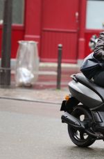 KRISTEN STEWART Riding a Bike on the Set of Personal Shopper in Paris 10/28/2015