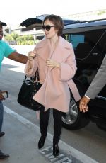 LILY COLLINS Arrives at Los Angeles International Airport 10/09/2015