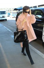 LILY COLLINS Arrives at Los Angeles International Airport 10/09/2015