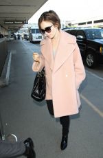 LILY COLLINS Arrives at Los Angeles International Airport 10/09/2015