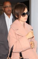LILY COLLINS Arrives at Los Angeles International Airport 10/09/2015