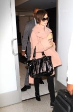 LILY COLLINS Arrives at Los Angeles International Airport 10/09/2015