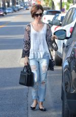 LILY COLLINS in Ripped Jeans Out and About in West Hollywood 10/21/2015