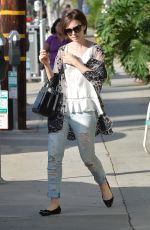 LILY COLLINS in Ripped Jeans Out and About in West Hollywood 10/21/2015