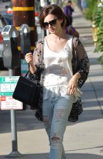 LILY COLLINS in Ripped Jeans Out and About in West Hollywood 10/21/2015