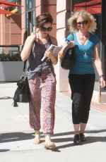 LILY COLLINS Out Shopping in Beverly Hills 09/30/2015