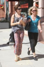LILY COLLINS Out Shopping in Beverly Hills 09/30/2015