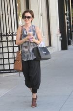 LILY COLLINS Out Shopping in Beverly Hills 10/01/2015