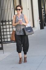 LILY COLLINS Out Shopping in Beverly Hills 10/01/2015