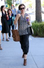 LILY COLLINS Out Shopping in Beverly Hills 10/01/2015