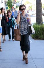 LILY COLLINS Out Shopping in Beverly Hills 10/01/2015