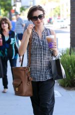 LILY COLLINS Out Shopping in Beverly Hills 10/01/2015