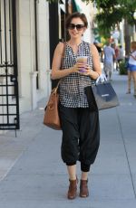 LILY COLLINS Out Shopping in Beverly Hills 10/01/2015