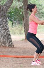 LUCY MECKLENBURGH Working Out with Her Sister Christie at a park in Ibiza 10/15/2015