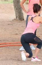 LUCY MECKLENBURGH Working Out with Her Sister Christie at a park in Ibiza 10/15/2015