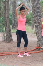 LUCY MECKLENBURGH Working Out with Her Sister Christie at a park in Ibiza 10/15/2015