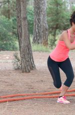 LUCY MECKLENBURGH Working Out with Her Sister Christie at a park in Ibiza 10/15/2015