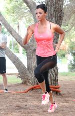 LUCY MECKLENBURGH Working Out with Her Sister Christie at a park in Ibiza 10/15/2015
