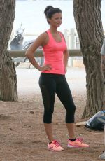 LUCY MECKLENBURGH Working Out with Her Sister Christie at a park in Ibiza 10/15/2015