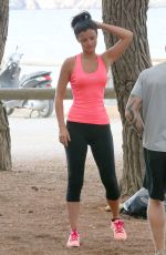 LUCY MECKLENBURGH Working Out with Her Sister Christie at a park in Ibiza 10/15/2015