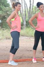 LUCY MECKLENBURGH Working Out with Her Sister Christie at a park in Ibiza 10/15/2015