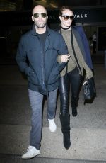 ROSIE HUNTINGTON-WHITELEY and Jason Statham at Los Angeles International Airport 10/07/2015