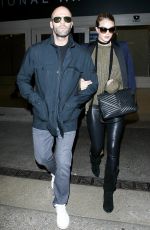 ROSIE HUNTINGTON-WHITELEY and Jason Statham at Los Angeles International Airport 10/07/2015