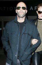 ROSIE HUNTINGTON-WHITELEY and Jason Statham at Los Angeles International Airport 10/07/2015
