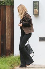 ROSIE HUNTINGTON-WHITELEY Arrives at Her Home in Los Angeles 10/16/2015