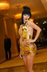 BAI LING in a Golden Minidress Night Out in Beverly Hills 11/06/2015