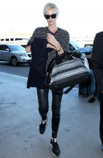 CHARLIZE THERON Arrives at Los Angeles International Airport 11/08/2015