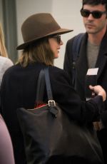 DAKOTA JOHNSON Arrives at LAX Airport in Los Angeles 11/19/2015