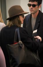 DAKOTA JOHNSON Arrives at LAX Airport in Los Angeles 11/19/2015