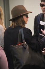 DAKOTA JOHNSON Arrives at LAX Airport in Los Angeles 11/19/2015