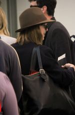 DAKOTA JOHNSON Arrives at LAX Airport in Los Angeles 11/19/2015